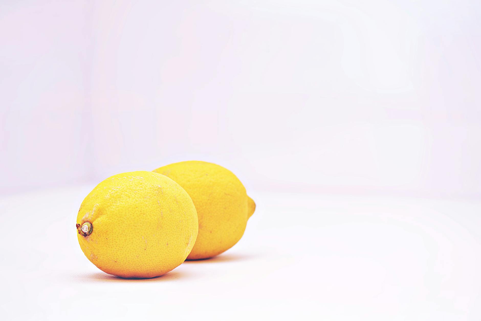 Two vibrant lemons symbolizing fresh sensation and reconnection