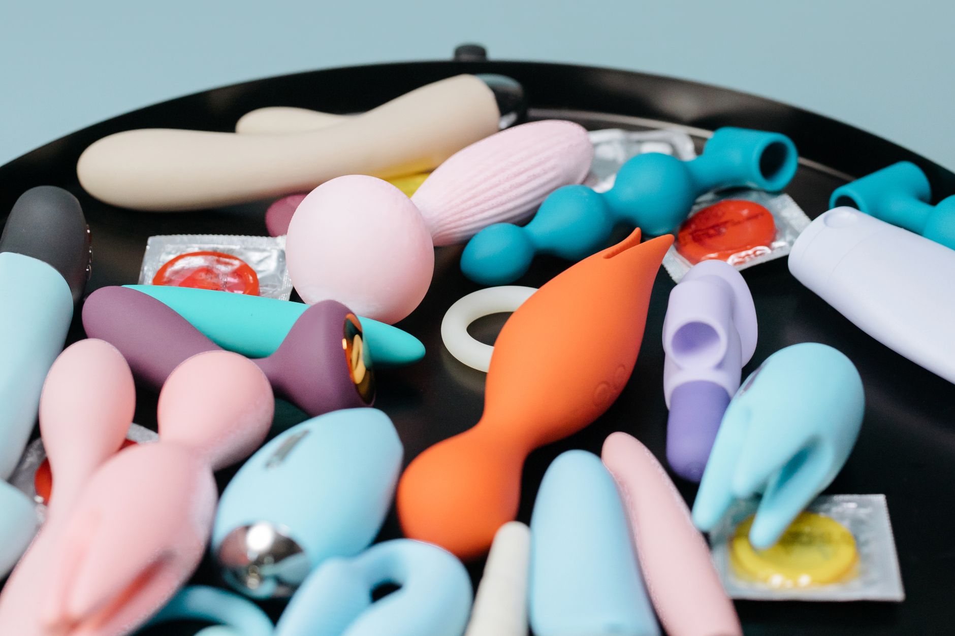 Collection of vibrant clitoral vibrators and adult toys displayed together