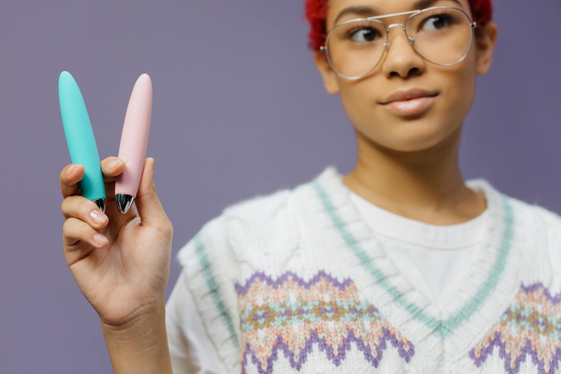 A hand holding a fresh lemon against a vibrant yellow background, symbolizing the freshness and rejuvenation of the Lem vibrator